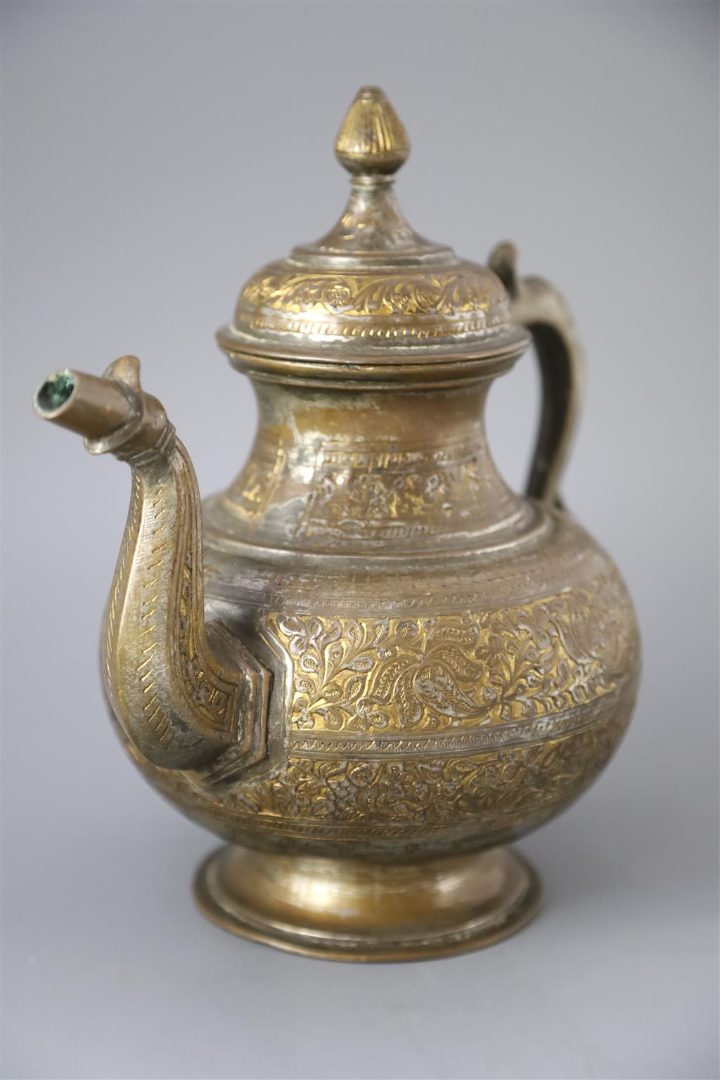 An 18th century Mughal Indian bronze and parcel gilt ewer, 26cm high